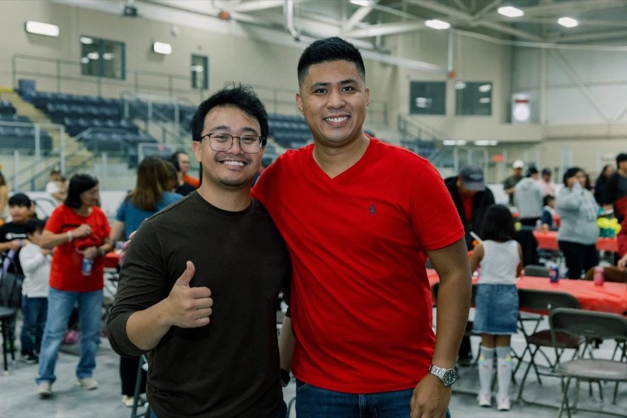 Two friends giving a thumbs up