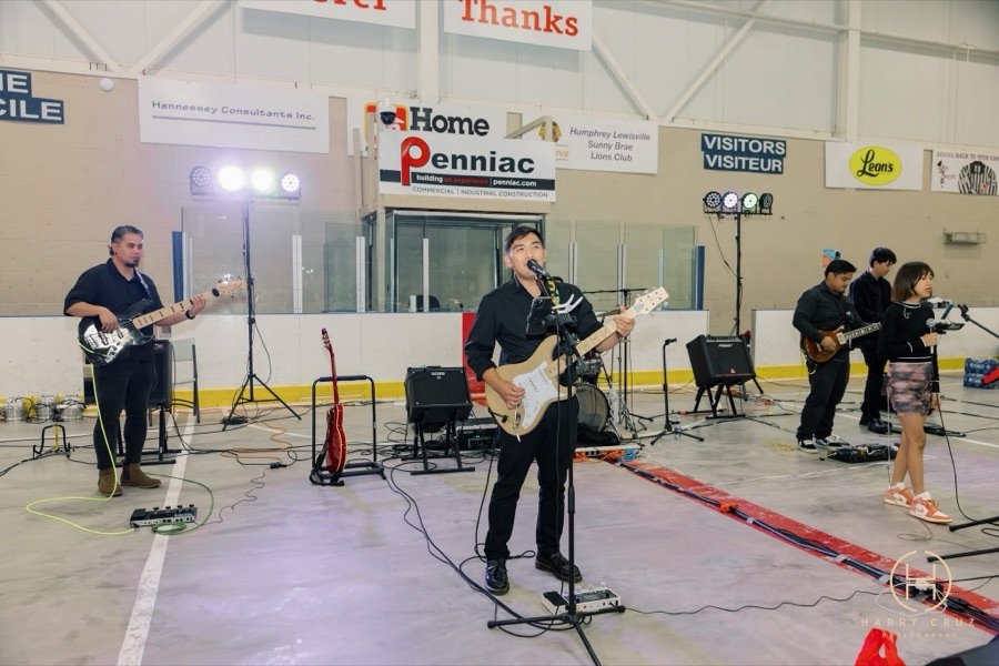 Live band performing on the rink for guests